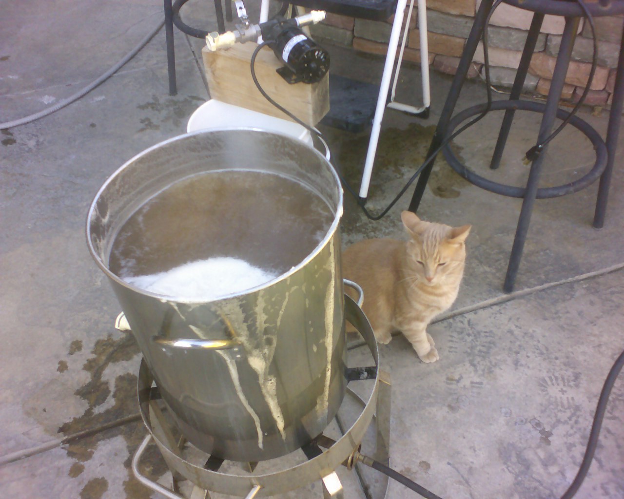 Otis is making sure there is not a boil-over.
