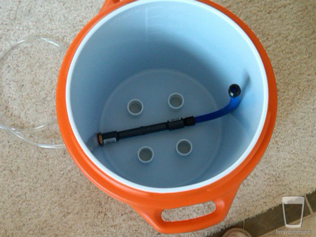 Fermenter Chiller - build
Using a weldless cooler bulkhead and plastic lawn-sprinkler tubes from Lowes, the drain goes across the bottom and up the opposite side.  The flexible plastic blue tube can be adjusted for water height.
