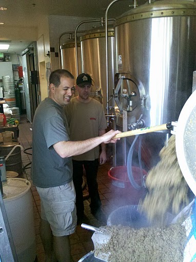 Tim extracting spent grain from the mash tun