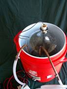 Carboy with copper cooling coil (AKA retired Imersion chiller) sitting in the cooler